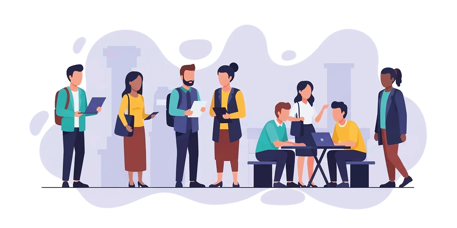 Gruppe arbeitet gemeinsam an Laptops